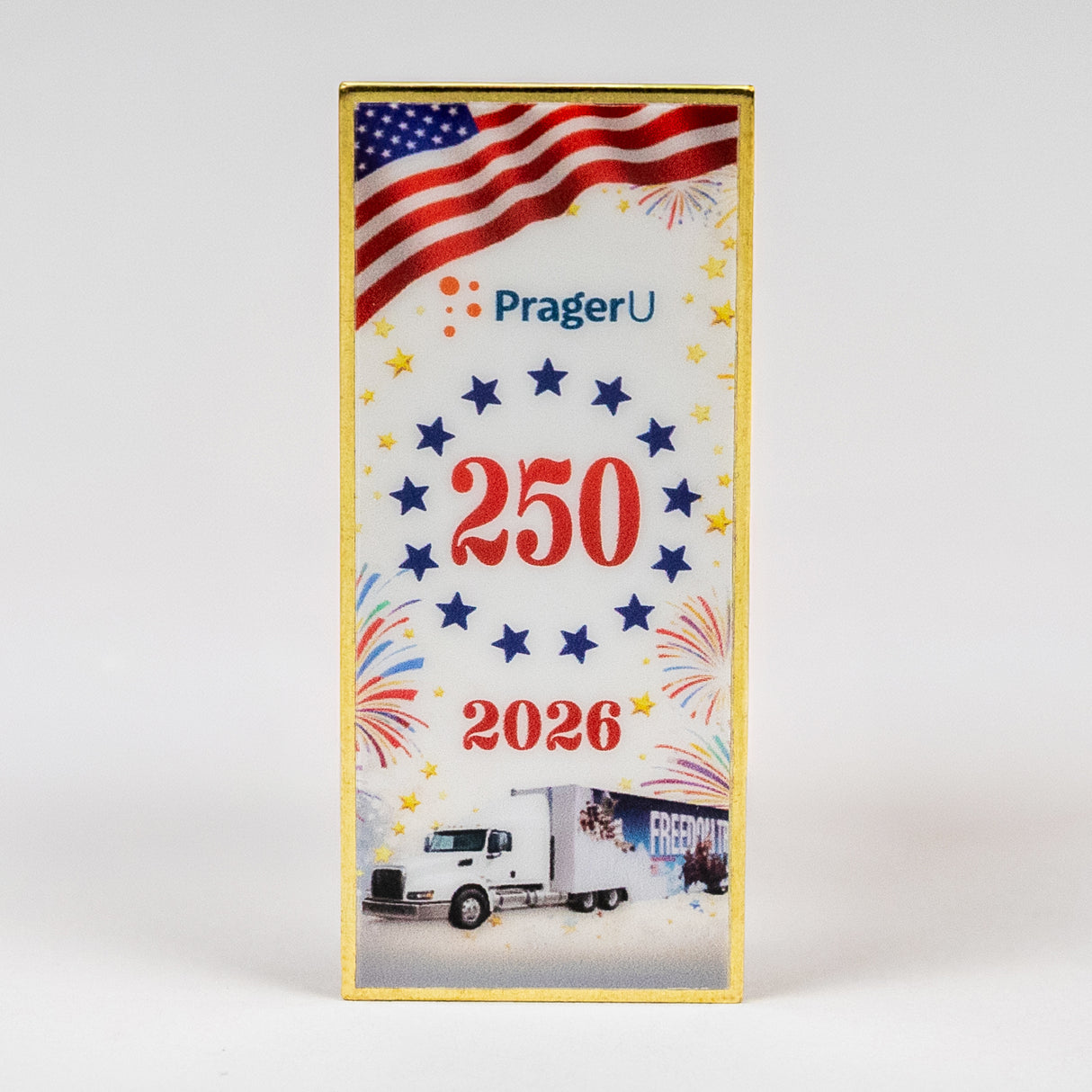 2026 America 250 Pin of the Year by PragerU featuring a gold-colored emblem with patriotic design and the year 2026.