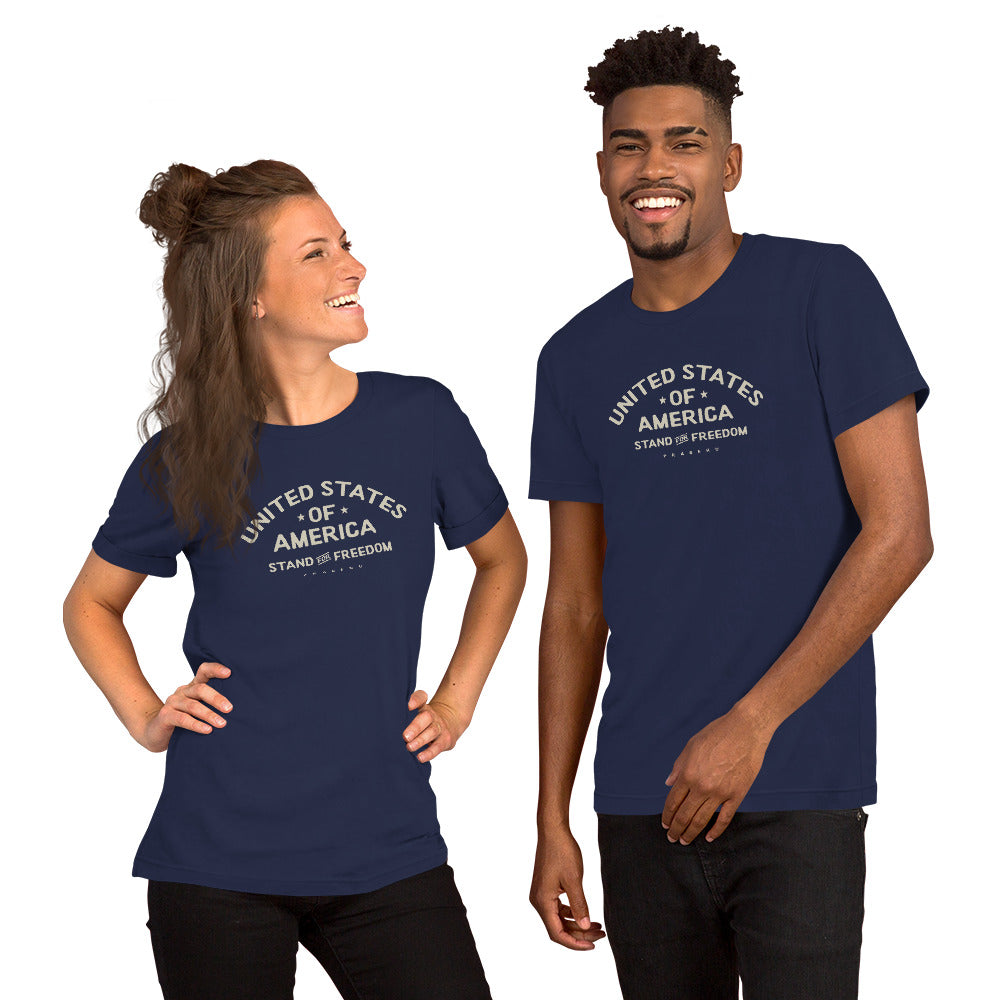 Beige PragerU "Stand for Freedom" T-shirt featuring a logo, displayed on a white background.