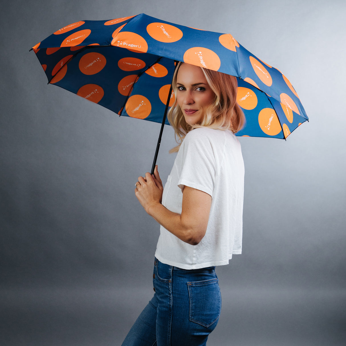 PragerU umbrella set featuring logo and design inspired by Life, Liberty & Happiness, with two matching umbrellas for rain protection.
