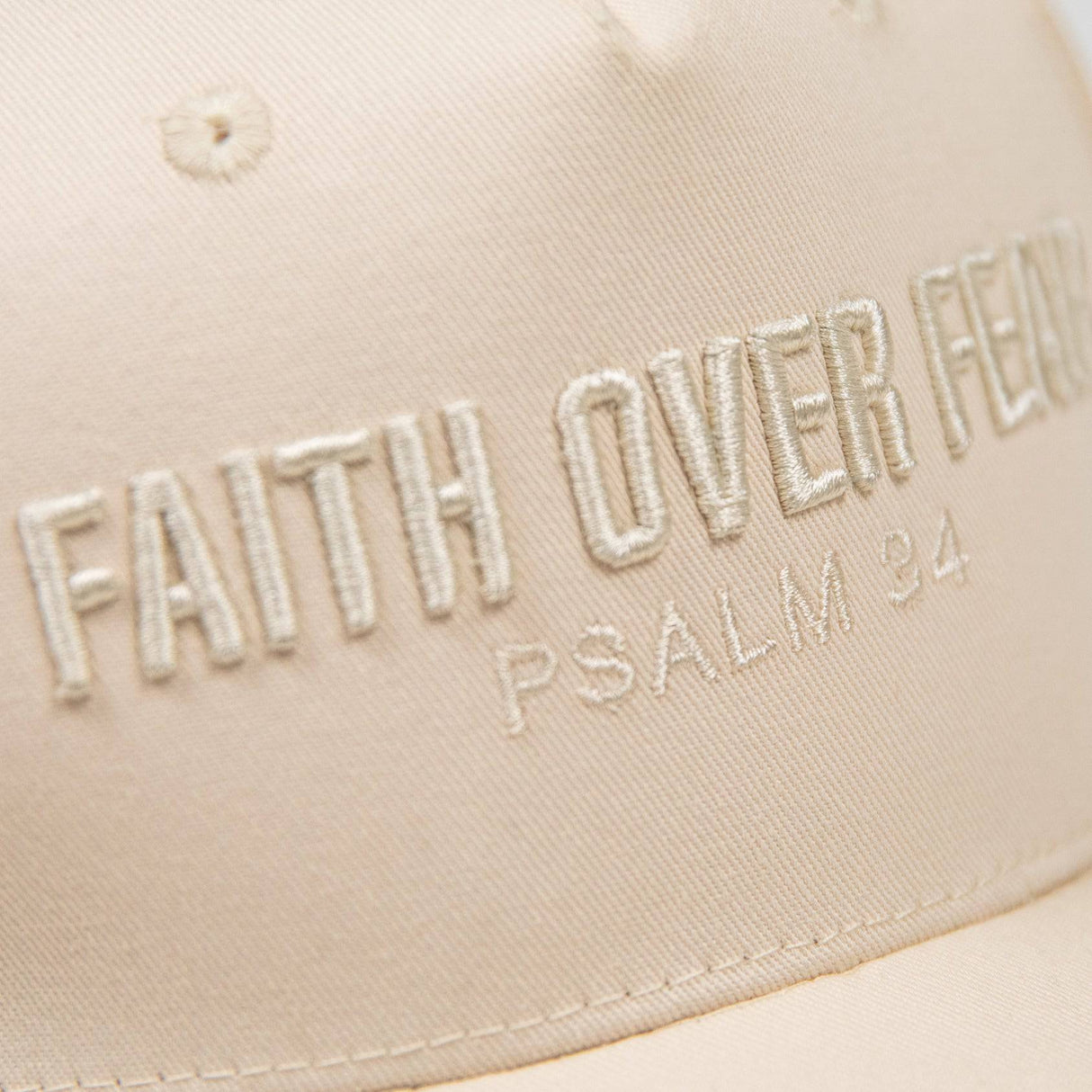 PragerU Faith Over Fear hat featuring embroidered text on a casual baseball cap, adjustable strap, and classic design.