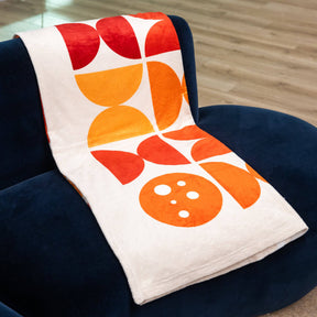 PragerU throw blanket with soft fabric and printed logo, showcasing a cozy and stylish home accessory.