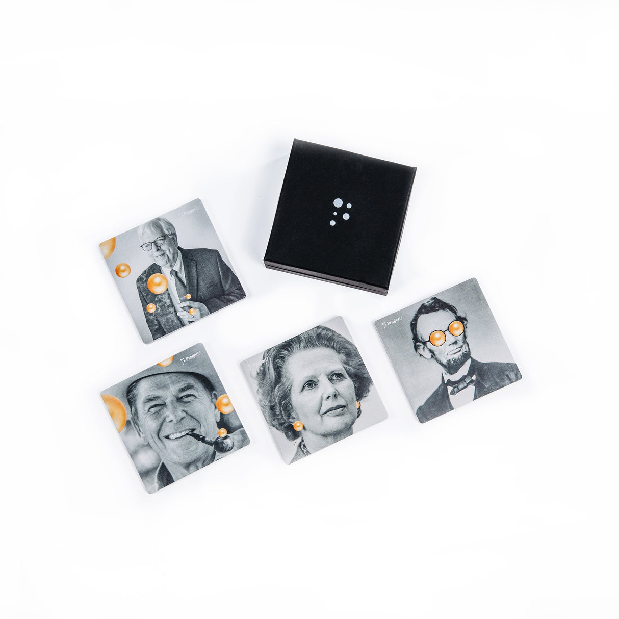 PragerU coaster set with four round coasters featuring educational designs, made of cork and ceramic for protecting surfaces.