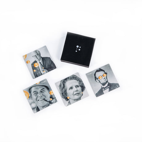 PragerU coaster set with four round coasters featuring educational designs, made of cork and ceramic for protecting surfaces.
