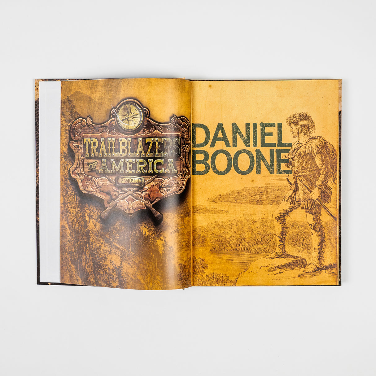 Book cover for "Trailblazers of America: Heroes of the Frontier" by PragerU showing frontier explorers and historical figures.