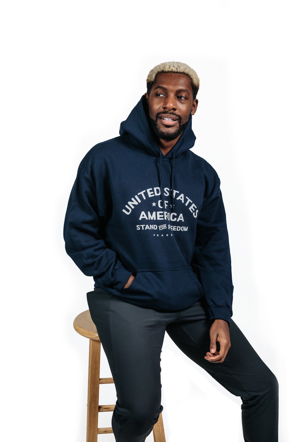 Beige "Stand for Freedom" hoodie by PragerU featuring a logo, displayed on a hanger against a white background.