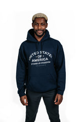 Beige PragerU "Stand for Freedom" hoodie with logo, casual fit, front view showing the printed logo on the chest.