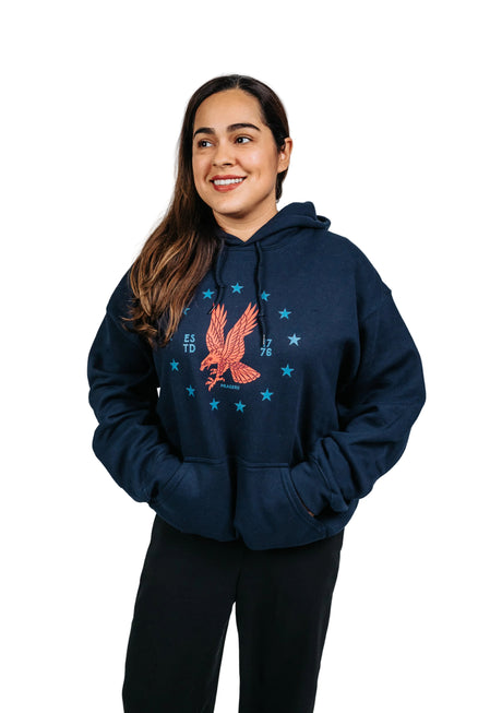 Red emblem on the front of a PragerU Freedom Eagle hoodie, casual hoodie style in a vibrant red color.
