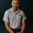 PragerU polo shirt in sport grey, men's size S, featuring the PragerU logo on the chest.