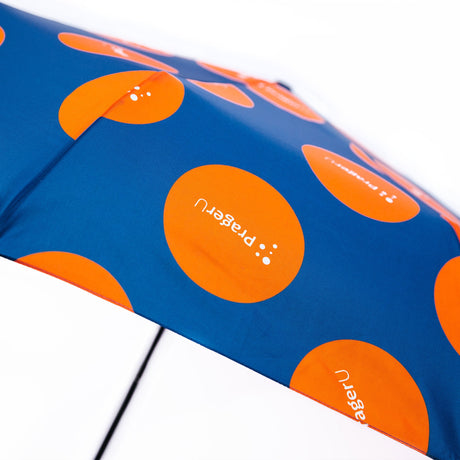 PragerU logo umbrella with black canopy featuring white PragerU logo, compact and rain-resistant for everyday use.