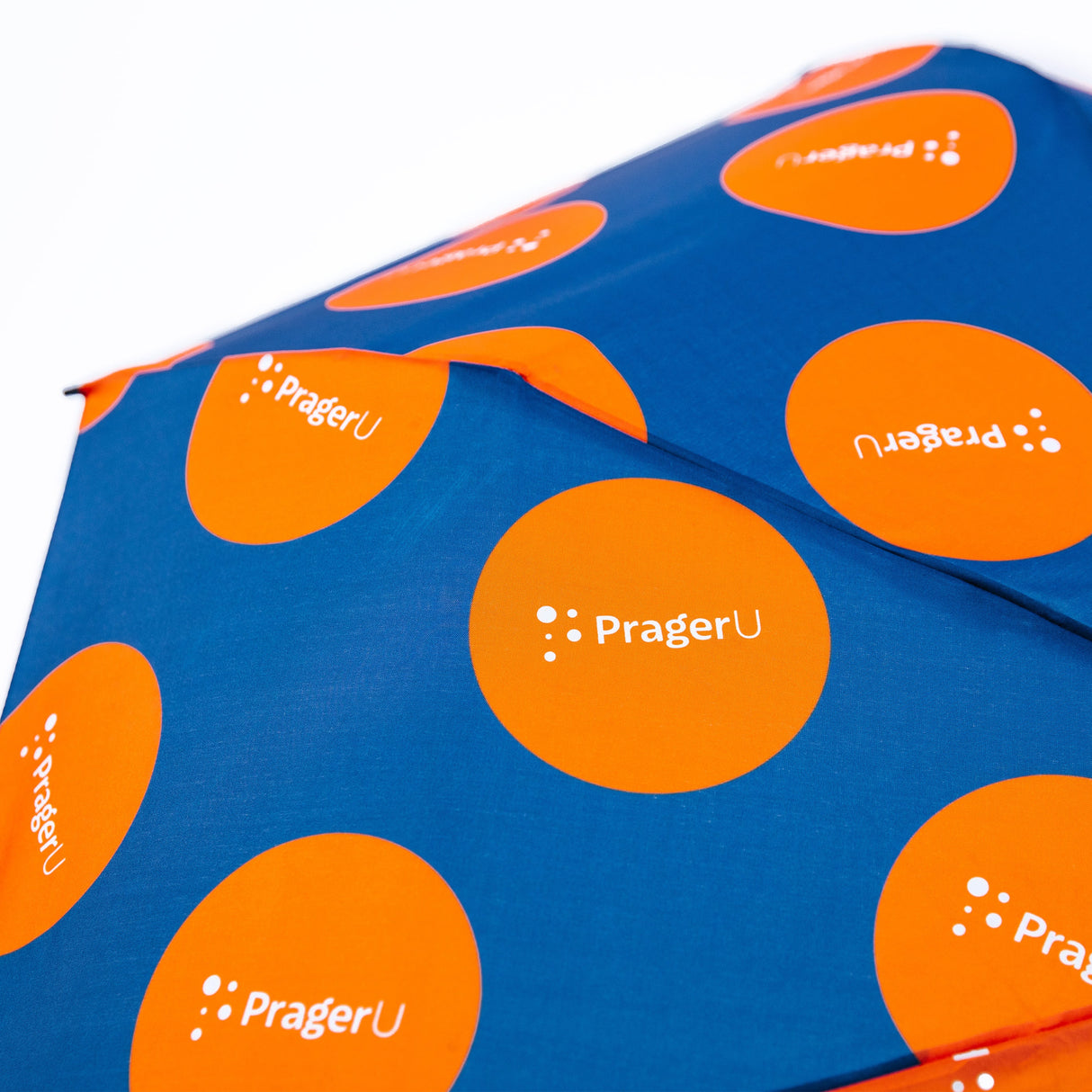 PragerU umbrella set featuring "Life, Liberty & Happiness" design with PragerU logo on a black umbrella.