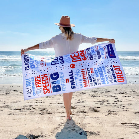 PragerU beach towel with vibrant logo and design, perfect for lounging at the beach or poolside.
