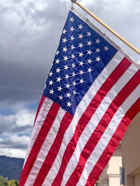 PragerU USA outdoor flag featuring the stars and stripes, suitable for display on a flagpole or outdoor setting.
