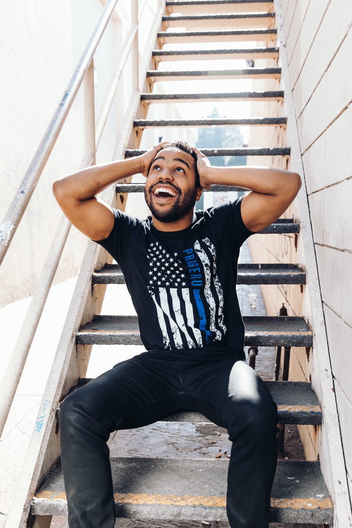 PragerU Thin Blue Line distressed flag T-shirt showing a navy blue flag with a blue line and worn, vintage style design.