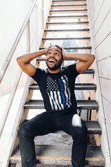 PragerU Thin Blue Line distressed flag T-shirt showing a navy blue flag with a blue line and worn, vintage style design.
