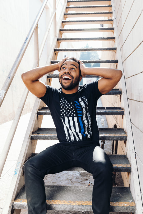 PragerU Thin Blue Line distressed flag T-shirt showing a patriotic blue line design on soft fabric.