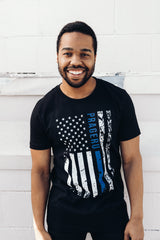 PragerU Thin Blue Line distressed flag T-shirt showing a navy blue flag with a single blue stripe and distressed design.
