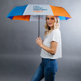 PragerU umbrella set featuring quotes about life, liberty, happiness, and the PragerU logo on navy blue umbrellas.